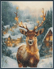 Stamped cross stitch mockup of a Deer with glowing antlers in a snowy village scene