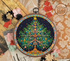 Stamped cross stitch design of Christmas tree design in an embroidery hoop on a decorative background with flowers.