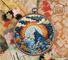 Stamped cross stitch design of a mountain scene, surrounded by decorative flowers