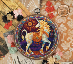 Stamped cross stitch design of a unicorn design on a decorative background with flowers and lace.
