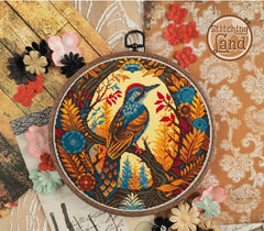 Stamped cross stitch design of a colorful bird design on a wooden surface with flowers.