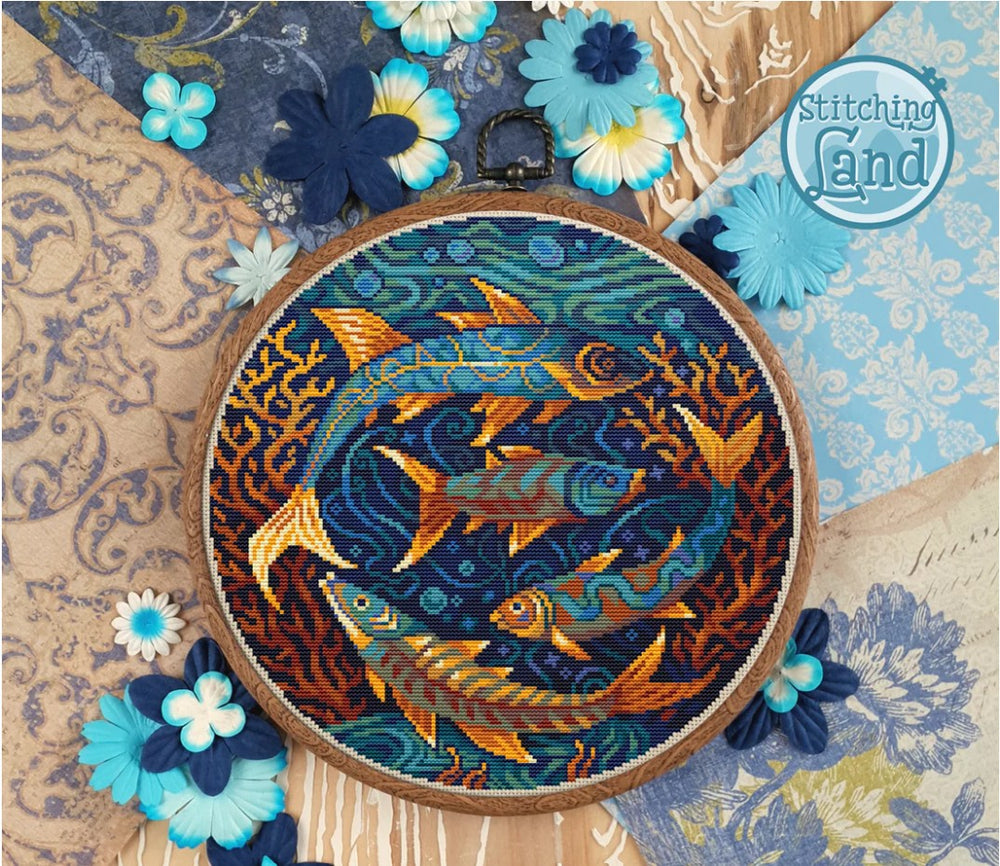 Stamped cross stitch design of fish design on a decorative background, featuring the brand 'Stitching Land'.