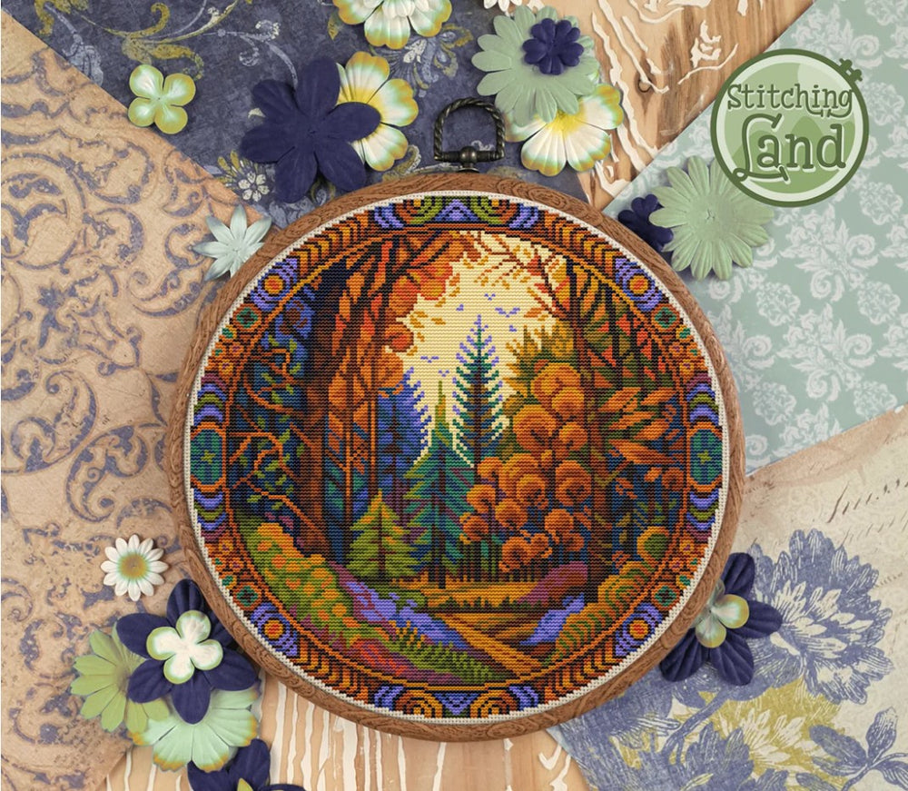 Stamped cross stitch design of a forest design surrounded by decorative flowers and fabric textures.