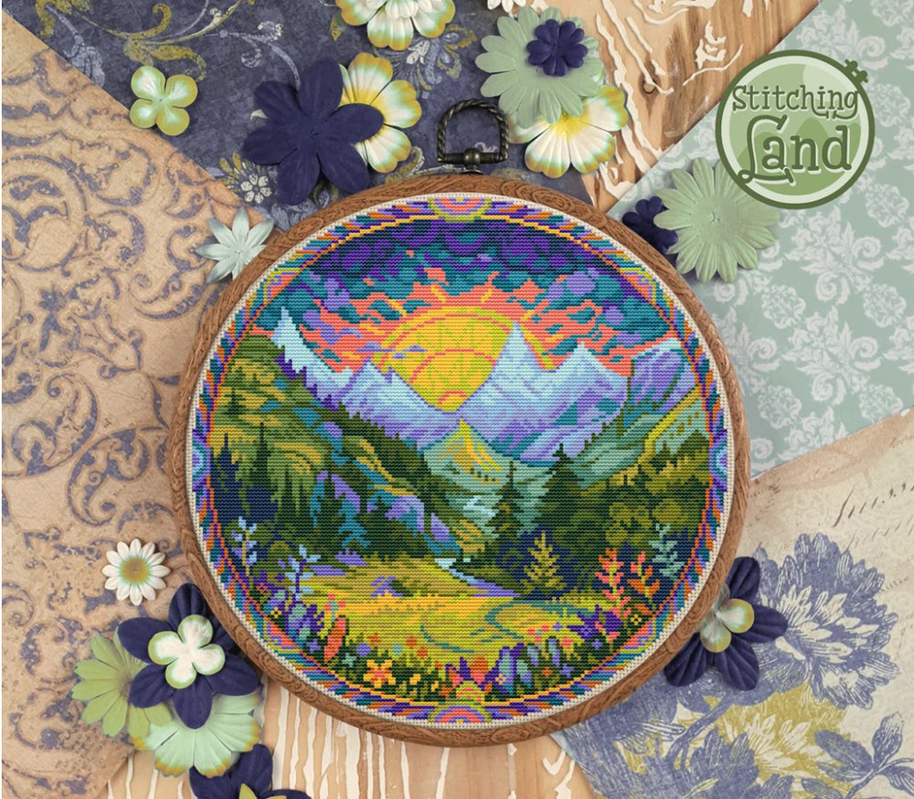 Stamped cross stitch design of a mountain landscape design on a textured fabric background
