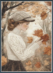 Stamped cross stitch mockup of a woman in an autumn setting holding leaves