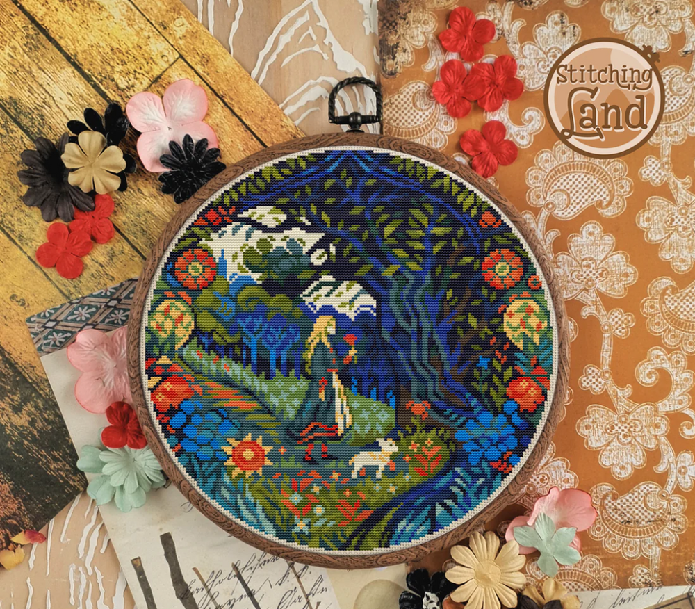 Stamped cross stitch mockup of a Embroidery hoop with a colorful landscape design on a decorative background with flowers and lace.