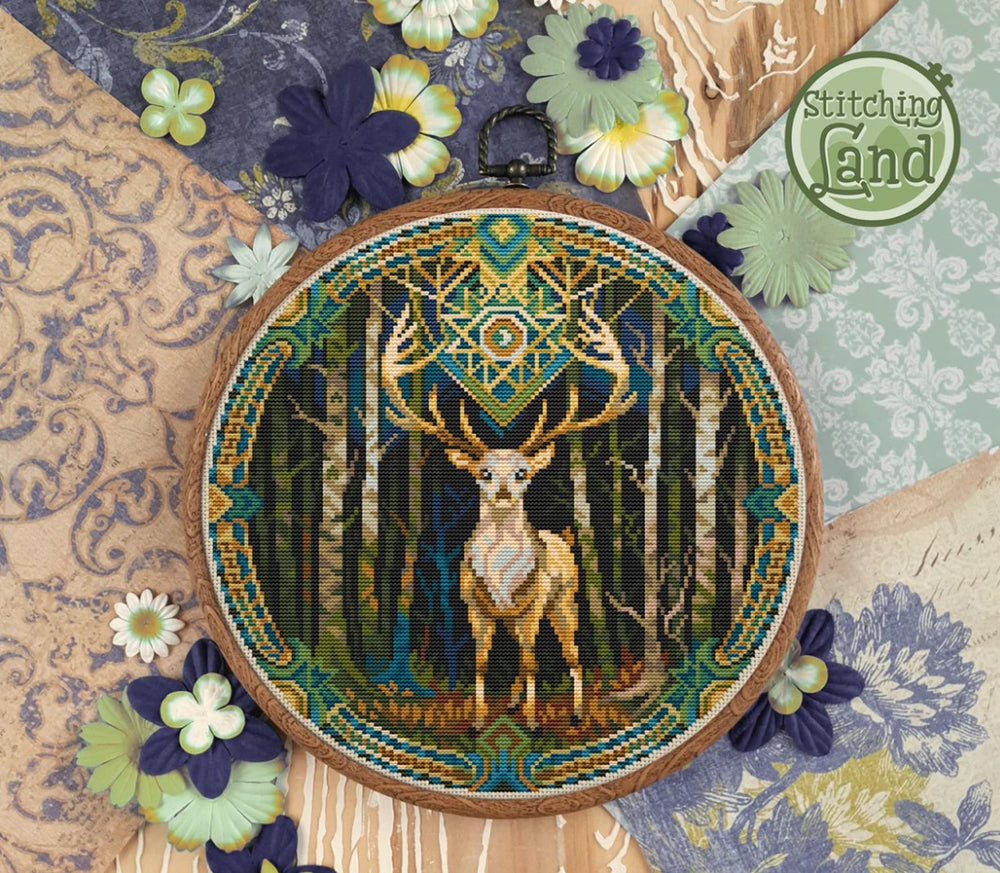 Stamped cross stitch design of a deer design on a decorative background with flowers and patterns.