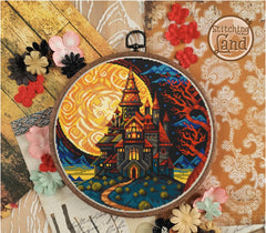 Stamped cross stitch design of a castle design on a decorative background with flowers and lace.