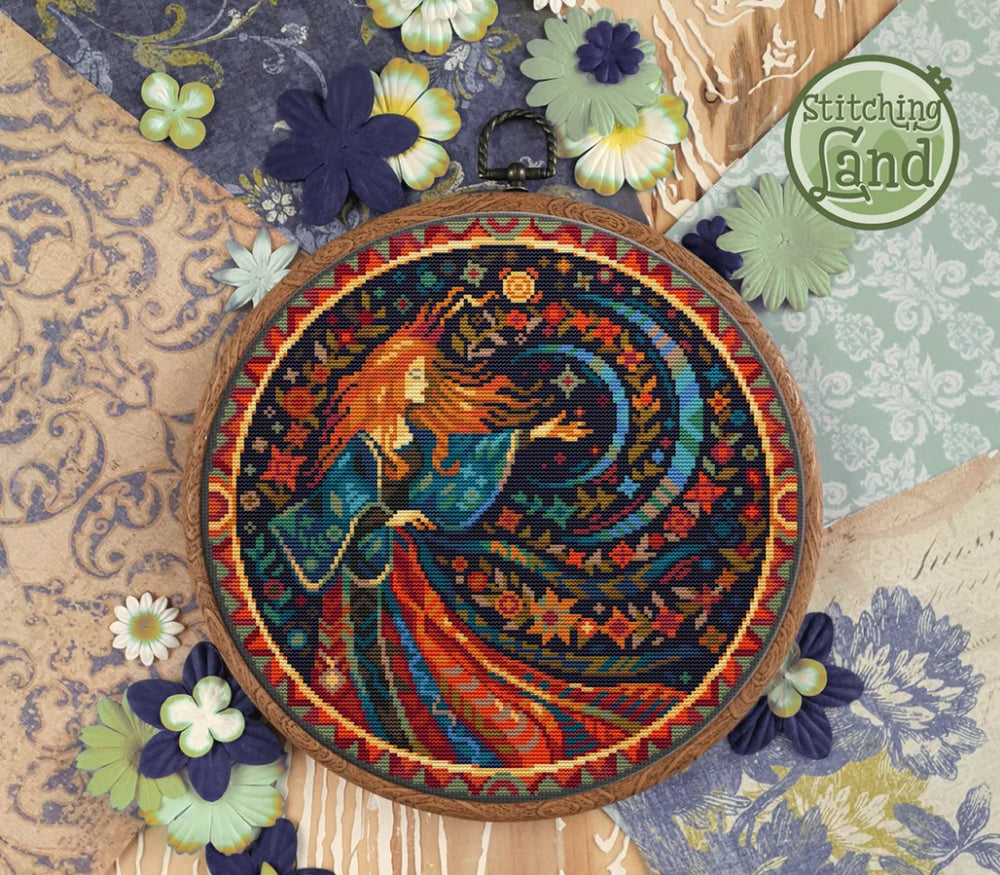 Stamped cross stitch design of f a woman and peacock, surrounded by decorative flowers and patterns.