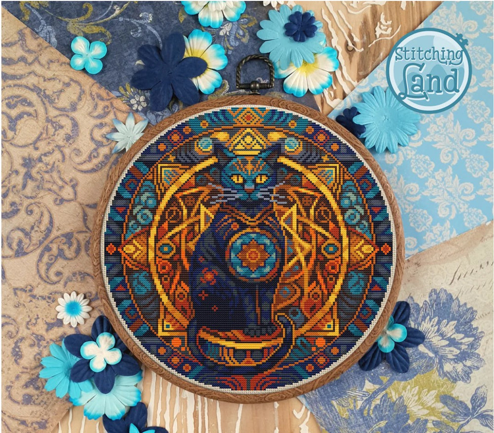 Stamped cross stitch design of a colorful cat design surrounded by decorative flowers