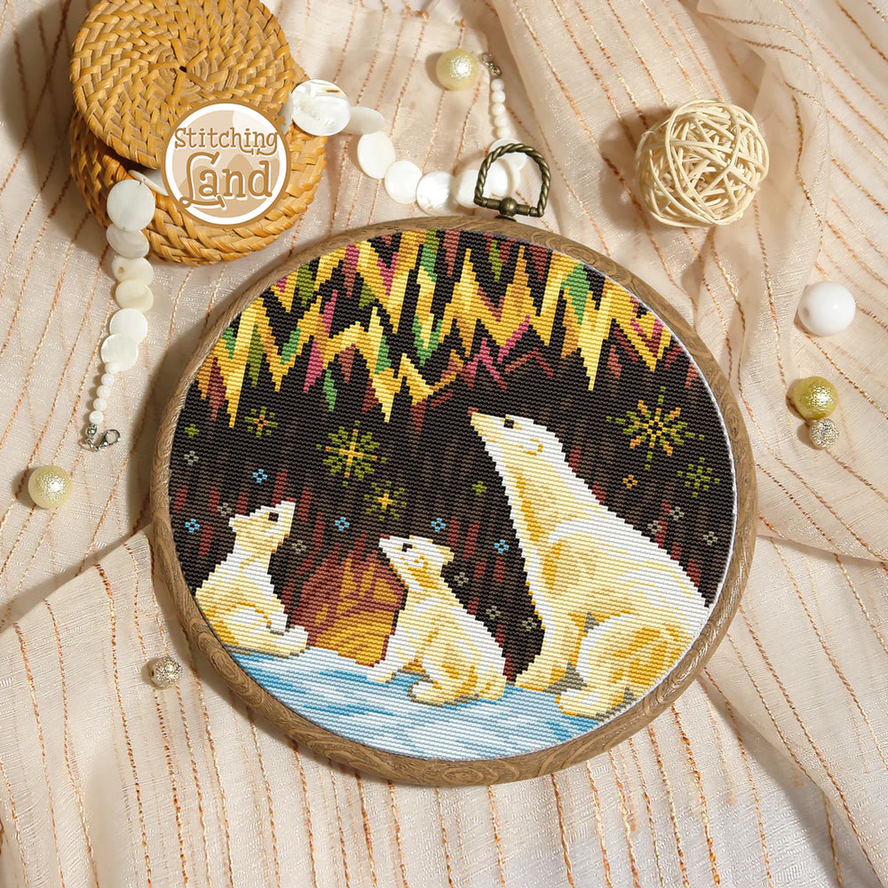 Stamped cross stitch mockup showing a Embroidery hoop with polar bear family design on a textured fabric background