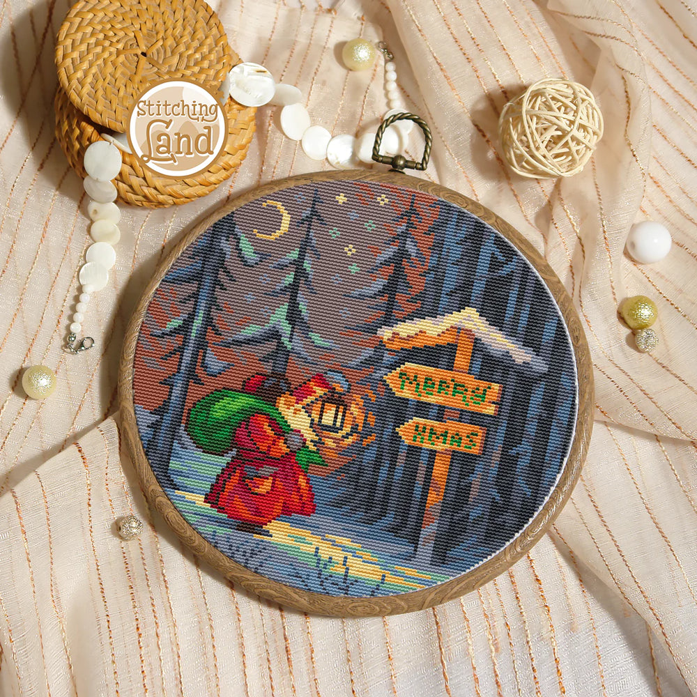 Stamped cross stitch mockup showing a Embroidery hoop with a winter scene design on a textured fabric background