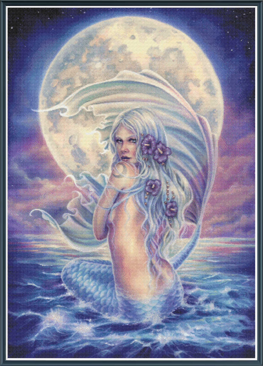 Mock up of a stamped cross stitch kit showing licensed artwork of a Mermaid with a flower in her hair against a moonlit sky