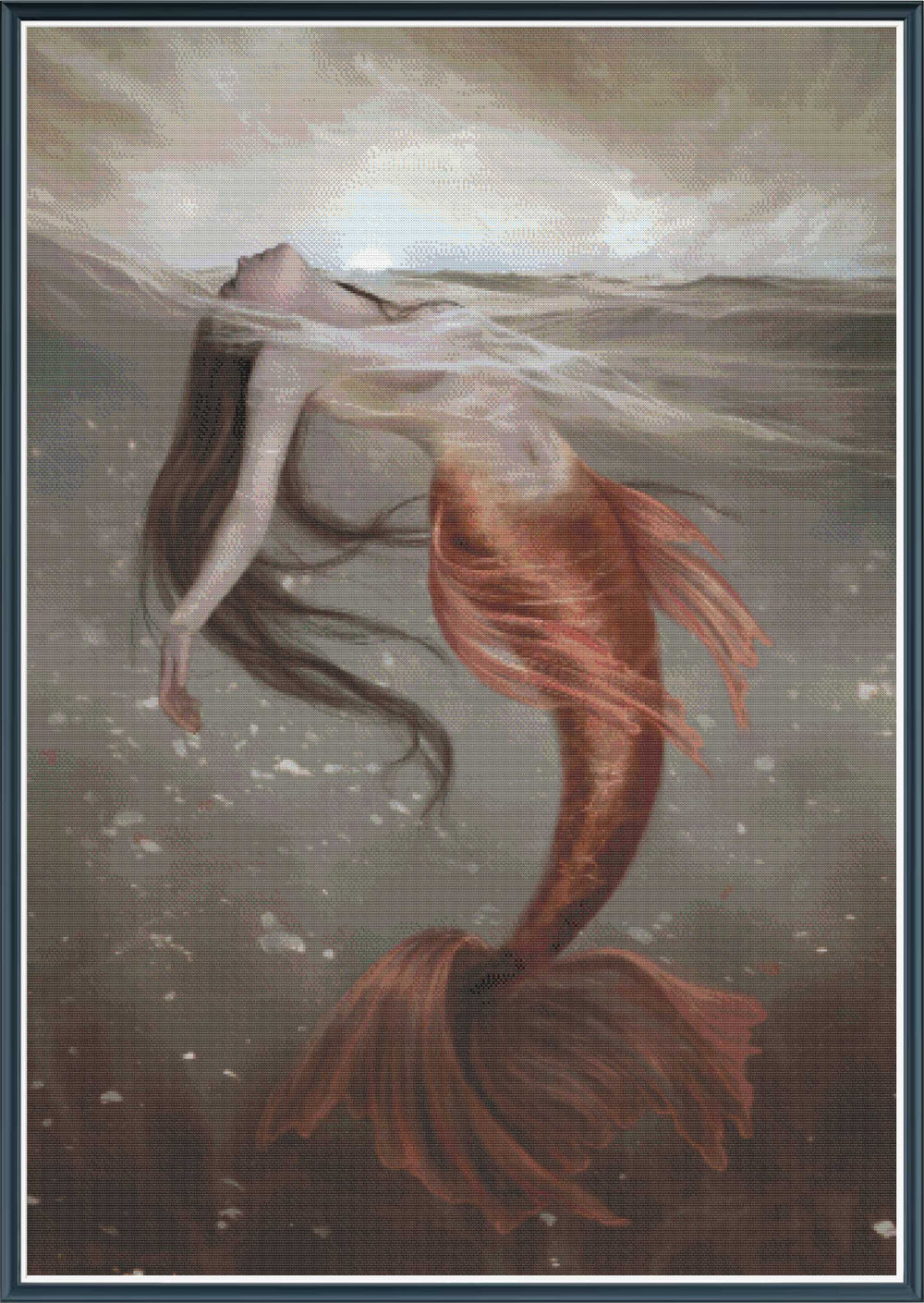 Stamped cross stitch mockup showing a licensed images of a Mermaid with a red tail floating underwater against a cloudy sky.