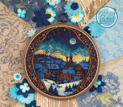 Stamped cross stitch design of a small town at night in winter