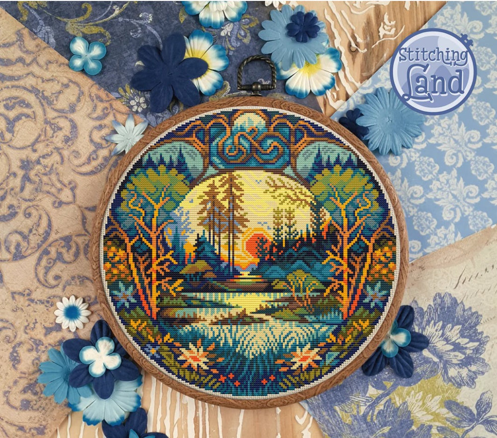 Embroidery hoop with a nature-themed small stamped cross stitch design surrounded by decorative flowers on a textured fabric background.