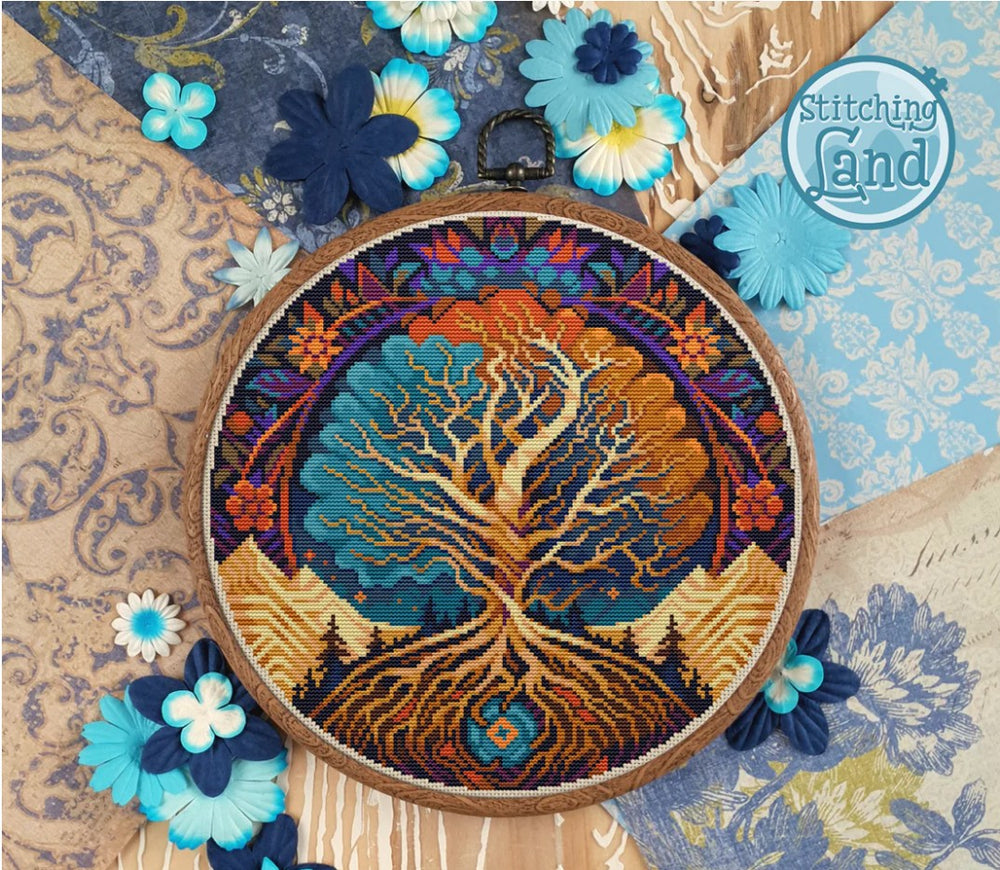 Stamped cross stitch design of a colorful tree design surrounded by decorative flowers on a patterned background.
