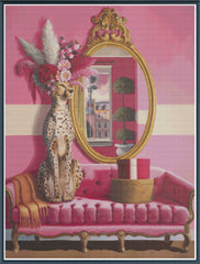 Decorative scene with a cheetah statue, mirror, and pink sofa on a pink background