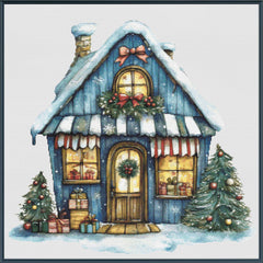 Decorative illustration of a blue Christmas-themed house with snow and festive decorations.