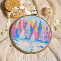 Stamped cross stitch mockup showing a  Embroidery hoop with colorful forest design on a textured fabric background